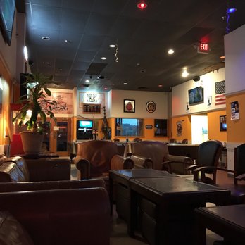Shesha - the inside of a restaurant with tables and chairs - Hookah Bars Near Me - Wichita, Kansas Shesha - the inside of a restaurant with tables and chairs - Hookah Bars Near Me - Wichita, Kansas