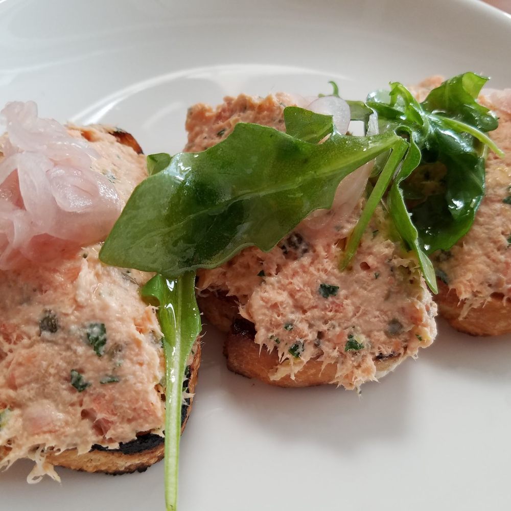 Capers + Olives - Bruschetta with smoked fish and capers and pickled shallots. - Italian Near Me - Everett, Washington