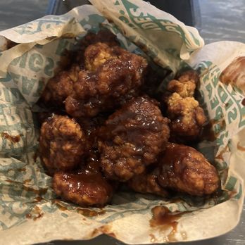 Wingstop - a basket of fried food on a table - Chicken Wings Near Me - Denver, Colorado