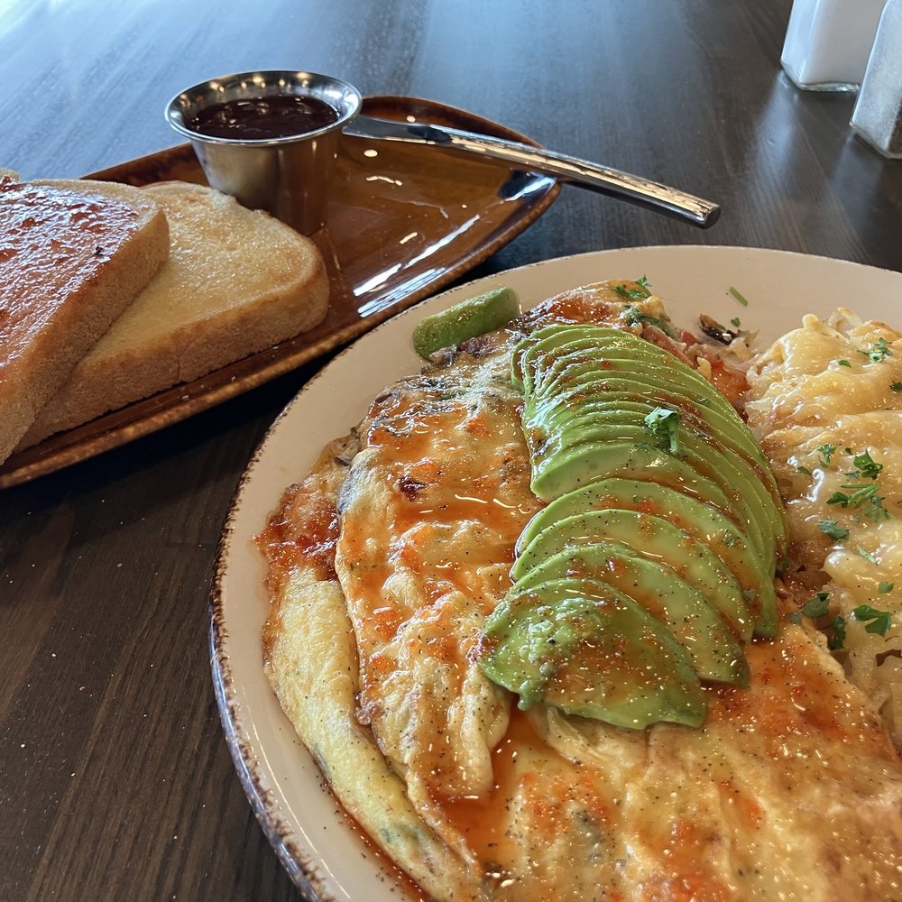 Breakfast Bear - Heirloom Honey Bear omelette topped with sliced avocado, Gouda hash browns, sour dough toast w/lovely jam - Breakfast & Brunch Near Me - Wausau, Wisconsin