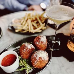 The Monarch Club - Truffle fries in the back and taleggio arancini in front