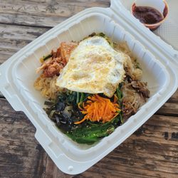Sun's Cafe - Veggie bi bim bap with rice, fried egg, spinach, seaweed, carrot, kimchi, bean sprouts, mushroom, and gochujang sauce