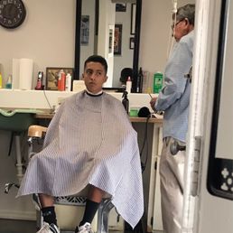 My son getting a much needed haircut. He walked out looking sharp!