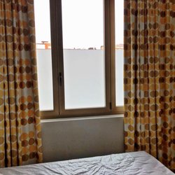 B&B Hotel Milano Sant'Ambrogio - The view from my 3rd floor room. A frosted glass panel blocks the view up to about 6 feet high !