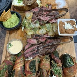 The experience - arrachera, sirloin, poppers, beans, guacamole, and papa