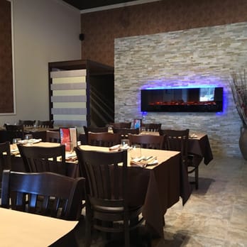 Bombay Bhel - a dining room with a fireplace - Indian Near Me - Kitchener, Ontario