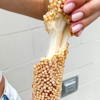 Two Hands Corn Dogs - Cheese pull on crispy rice - Hot Dogs Near Me - Houston, Texas Two Hands Corn Dogs - Cheese pull on crispy rice - Hot Dogs Near Me - Houston, Texas