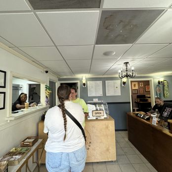 Lilikoi Kitchen - Tiny space where you order, with the kitchen on the left and a very busy tattoo parlor on the right. - Coffee & Tea Near Me - Kailua, Hawaii