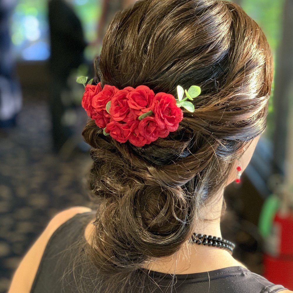 Lovely twistback updo with flowers Lovely twistback updo with flowers