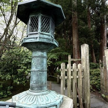 Japanese Tea Garden - A beautiful old-fashioned lamp/lantern. With a plaque in front detailing the information in English as well in characters. - Tea Rooms Near Me - San Francisco, California