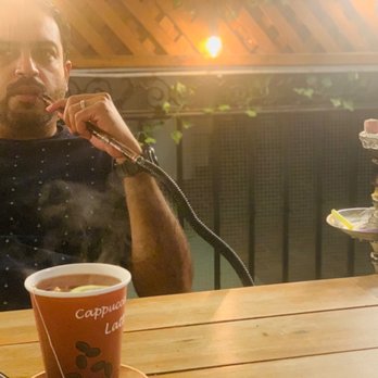 Medmix Grill - Husband enjoying shisha - Mediterranean Near Me - Garden Grove, California Medmix Grill - Husband enjoying shisha - Mediterranean Near Me - Garden Grove, California