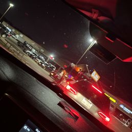 Cars waiting while employees visit with their friends. Cars waiting while employees visit with their friends.