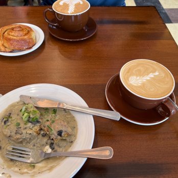 Black Cat Coffeehouse - Sm order of Biscuits & mushroom gravy. Bourbon brwn sugar latte. In backgrd, cinnamon roll & mocha latte w/ maple syrup. Delish! - Breakfast & Brunch Near Me - Ashland, Wisconsin