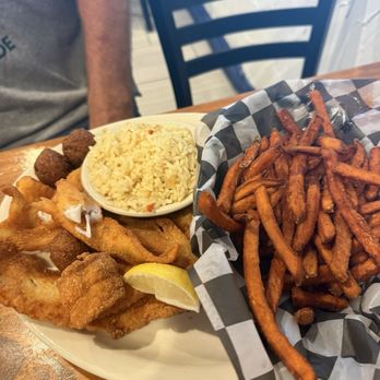 Captain’s Diner - Fish platter with sweet potato fries and rice. - Seafood Near Me - Corpus Christi, Texas Captain’s Diner - Fish platter with sweet potato fries and rice. - Seafood Near Me - Corpus Christi, Texas