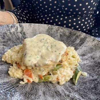 Divieto Ristorante - Estero - Sea Bass with creamy butter sauce over vegetable Risotto - Italian Near Me - Estero, Florida Divieto Ristorante - Estero - Sea Bass with creamy butter sauce over vegetable Risotto - Italian Near Me - Estero, Florida