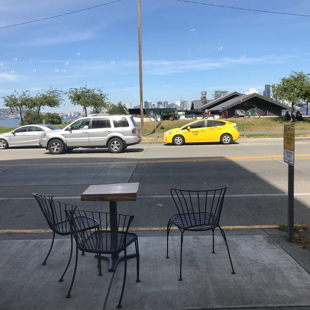Unwind Cafe - Outside view facing the water side- outdoor seating as well. - Coffee & Tea Near Me - Seattle, Washington Unwind Cafe - Outside view facing the water side- outdoor seating as well. - Coffee & Tea Near Me - Seattle, Washington