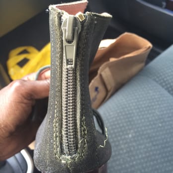 Austin Shoe Repair - A very badly repaired zipper with sloppy stitching, gold teeth and pulled thread I was advised to cut off myself. - Shoe Repair Near Me - Austin, Texas