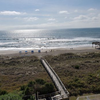 Golden Sands Carolina Beach Oceanfront Tapestry by Hilton - Walkway for the Golden Sands to the beach. Steep drop off steps at the end. April, 2021. - Hotels Near Me - Carolina Beach, North Carolina Golden Sands Carolina Beach Oceanfront Tapestry by Hilton - Walkway for the Golden Sands to the beach. Steep drop off steps at the end. April, 2021. - Hotels Near Me - Carolina Beach, North Carolina