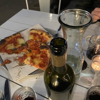 Cornelly - Pepperoni pizza and a fantastic bottle of wine - Italian Near Me - Seattle, Washington Cornelly - Pepperoni pizza and a fantastic bottle of wine - Italian Near Me - Seattle, Washington
