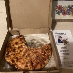 Captain's Pizza Restaurant & Bar - Half Cheese and Bacon Pizza.