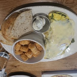 Veggie omelet w/ tots and sourdough toast. I had the same thing today but subbed the Swiss to cheddar and the toast to a pancake! Veggie omelet w/ tots and sourdough toast. I had the same thing today but subbed the Swiss to cheddar and the toast to a pancake!