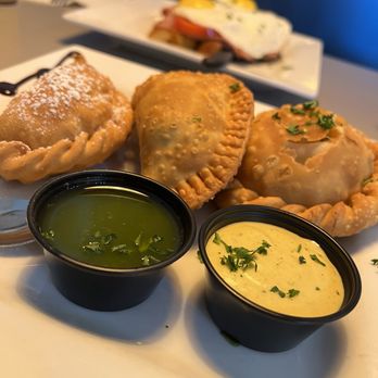 Wake Up Café - Empanadas (chicken, "Messi" chorizo, batata (sweet potato, chocolate, cheese) all were fantastic - American Near Me - New Smyrna Beach, Florida Wake Up Café - Empanadas (chicken, "Messi" chorizo, batata (sweet potato, chocolate, cheese) all were fantastic - American Near Me - New Smyrna Beach, Florida