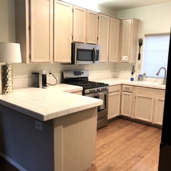 Cedars Builders - Kitchen - Before. Tile countertops, contractor grade cabinets. - General Contractors Near Me - Los Angeles, California