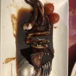 Osaka Japanese Steakhouse - Half eaten grilled squid.