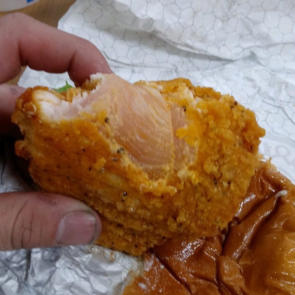Wendy's - a hand holding a chicken sandwich - Burgers Near Me - Cottage Grove, Minnesota Wendy's - a hand holding a chicken sandwich - Burgers Near Me - Cottage Grove, Minnesota