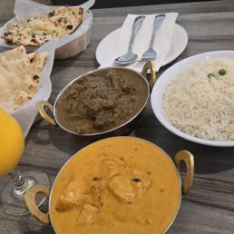 Curry lamb, chicken taikki masala, butter Naan, garlic Naan.