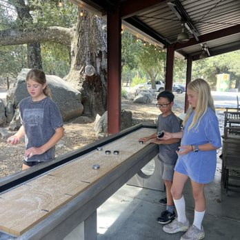 Calico Cidery - Shuffle board with jumping rocks in the background. - Cideries Near Me - Julian, California
