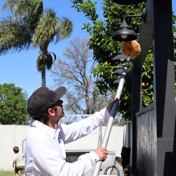 Crest Pest Control - Removing spider webs from a customer's yard - Pest Control Near Me - Upland, California Crest Pest Control - Removing spider webs from a customer's yard - Pest Control Near Me - Upland, California
