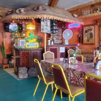 Mamy's Place - a dining room with neon signs - Mexican Near Me - Long Beach, California