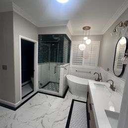 a large bathroom with a walk in shower a large bathroom with a walk in shower