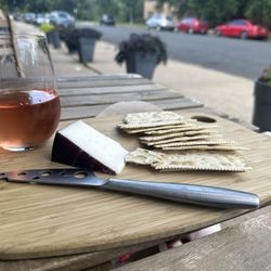 Sisters' Sludge Coffee Cafe and Wine Bar - Rose and cheese outdoor front patio