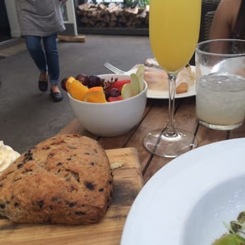 Tiny Boxwoods - Blueberry scone, a side of fresh fruits and mimosa. - New American Near Me - Houston, Texas Tiny Boxwoods - Blueberry scone, a side of fresh fruits and mimosa. - New American Near Me - Houston, Texas