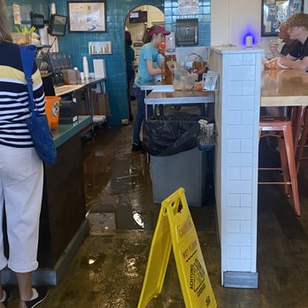Tropical Smoothie Cafe - The spill.. the workers shirt stained with whatever that could be. - Sandwiches Near Me - Naples, Florida Tropical Smoothie Cafe - The spill.. the workers shirt stained with whatever that could be. - Sandwiches Near Me - Naples, Florida