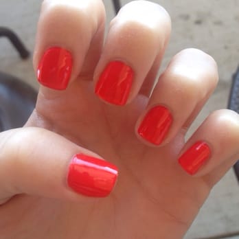 Deluxe Nails & Spa - Got a mani pedi with this summer orange-pink color - Nail Salons Near Me - Cypress, Texas