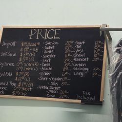 Coin Laundry - September 2023 prices. Left side is regular wash. Right side is dry cleaning.
