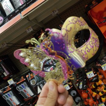 Walgreens - a hand holding a mask in a store - Drugstores Near Me - Albuquerque, New Mexico