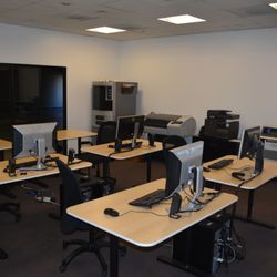 Urban Workshop - Engineering computer lab with design software, programming tools, CNC programming software, large format printer, and vinyl cutter