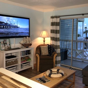 The Victorian Condominiums - Living room from the kitchen with ocean view - Condominiums Near Me - Galveston, Texas