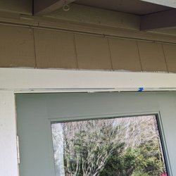 Spruce Box Construction - Trim paint above new patio door has been left on siding - no touch up.