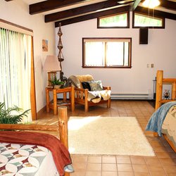 J-T Ranch - Master bedroom in the Creekhouse features is own fireplace and private Creekside patio.