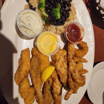 O'Charley's Restaurant & Bar - Surf and turf. Catfish, chicken tenders and shrimp with rice medley - American Near Me - Boardman, Ohio