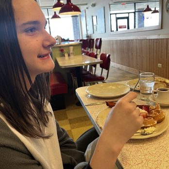 Rosie’s Home Cookin' - T having a great meal of Big Apple pancake, Strawberry waffle, and thick cut bacon - Breakfast & Brunch Near Me - Naperville, Illinois