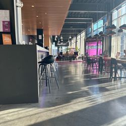 Moxy Aberdeen Airport - Part of the lobby, lounge area and the bar on the left