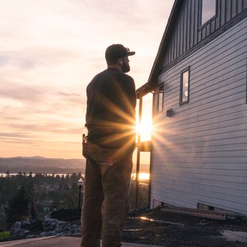 RHC Construction - a man standing in front of a house - General Contractors Near Me RHC Construction - a man standing in front of a house - General Contractors Near Me