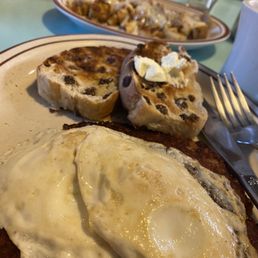 Breakfast corned beef has and eggs, stuffed pancakes and home fries w/cheddar.