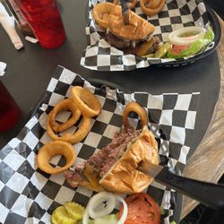 Highline Cafe & Saloon - Gold Medal Buffalo Burger with perfectly cooked to perfection onion rings;